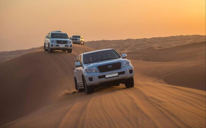 Experience the tranquility of the Lahbab desert as sun-kissed dunes invite adventure. Delight in an exhilarating 30-minute dune bashing ride where endless sands meet stunning horizons.